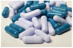 photo of white and blue medical pills